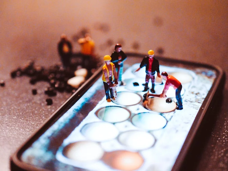 Best Gadgets for Remote Workers in 2024 - Playing with miniature people photography