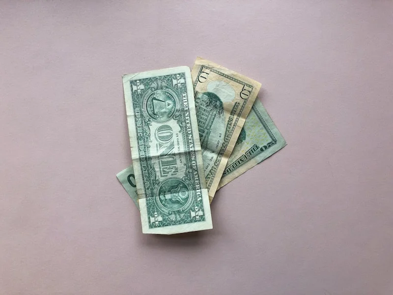 how much does it cost to replace HVAC system - The back of an American one, ten, and twenty dollar bills, United States currency.